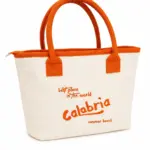 Borsa mare calabria tessuto crema manici arancioni imbottiti scritta best place in the world