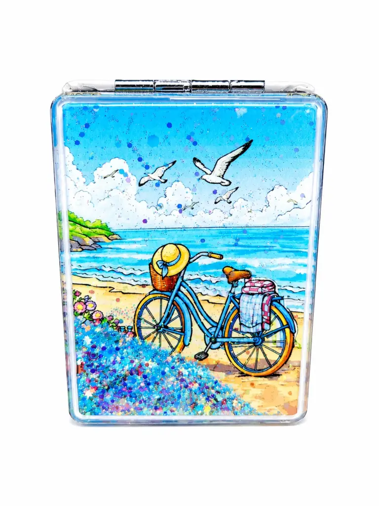 Specchietto rettangolare con bicicletta azzurra sulla spiaggia, mare turchese e glitter blu decorativi