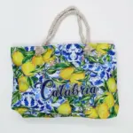 Borsa mare calabria limoni gialli con manici corda intrecciata e scritta corsivo blu
