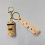 Portachiavi bauletto multicolore crema con stelle dorate e ciondolo decorato simboli colorati