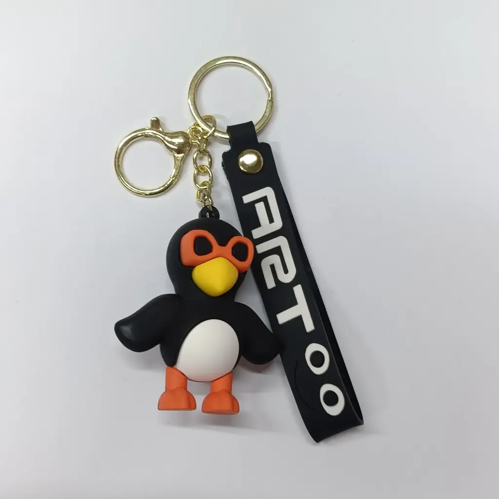 Portachiavi pinguino Frulli Frulla in gomma con targhetta FIER100 e moschettone dorato