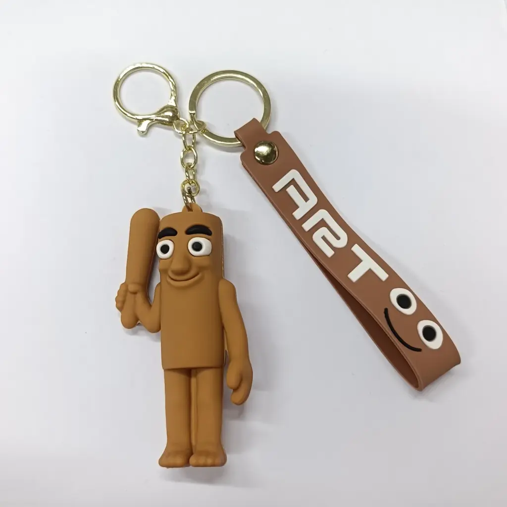 Portachiavi figura stilizzata gomma caramello con fascetta similpelle marrone scritta FIAT