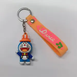 Portachiavi Doraemon in gomma blu e bianco con cappello arancione e fascetta silicone