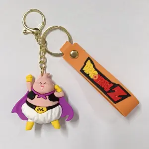 Portachiavi Dragon Ball Z con figura Majin Bu viola e ciondolo arancione su sfondo bianco