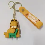Portachiavi gomma Garfield seduto sedia verde con pendente giallo Cinque Terre