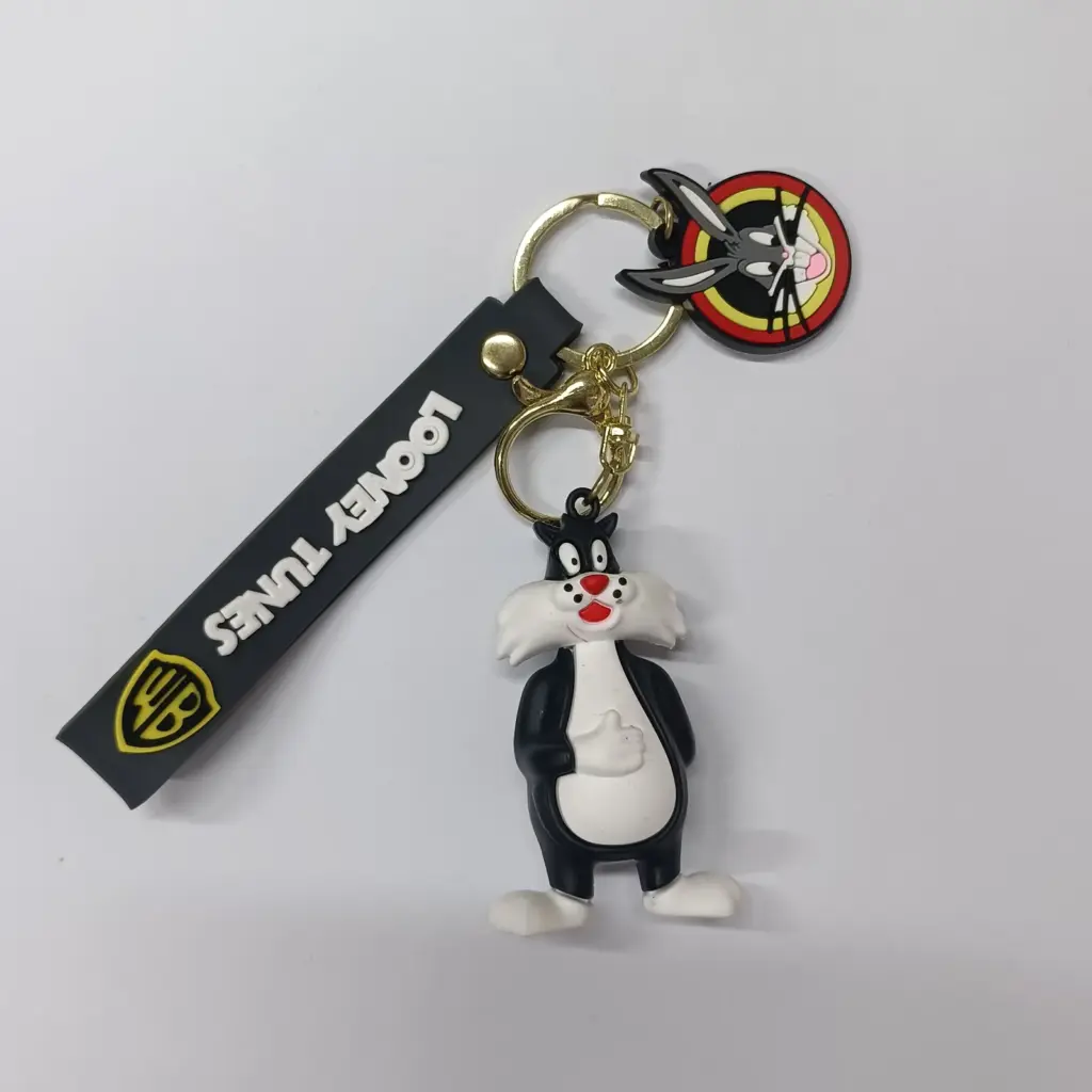 Portachiavi Looney Tunes Silvestro gomma bianco nero con anello dorato e charm rosso giallo