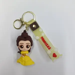 Portachiavi principessa Disney con figura 3D abito giallo e ciondolo nastro beige Princess