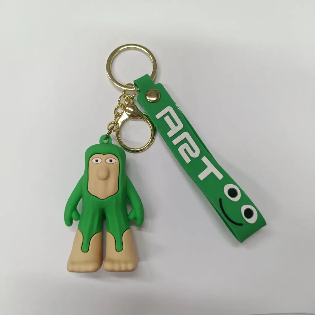 Portachiavi Pistoia con figura verde in gomma e ciondolo rettangolare con scritta bianca