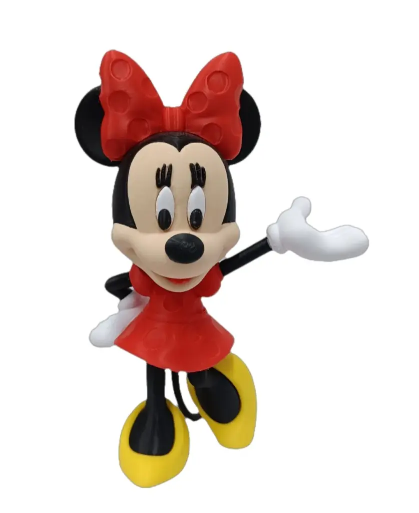 Statuetta Minnie Mouse in resina rossa con fiocco a pois bianchi e braccio alzato in saluto