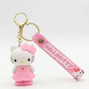 Portachiavi Hello Kitty con figura rosa in abito e fiocco, targhetta gommata rosa con scritta in rilievo e anello metallico dorato
