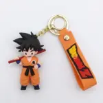 Portachiavi Son Goku Dragon Ball Z: figura in gomma arancione con bastone rosso e ciondolo arancione con logo