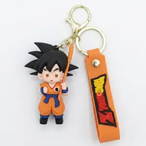 Portachiavi Dragon Ball Z con figura Son Goku in gomma arancione, moschettone dorato e linguetta con logo