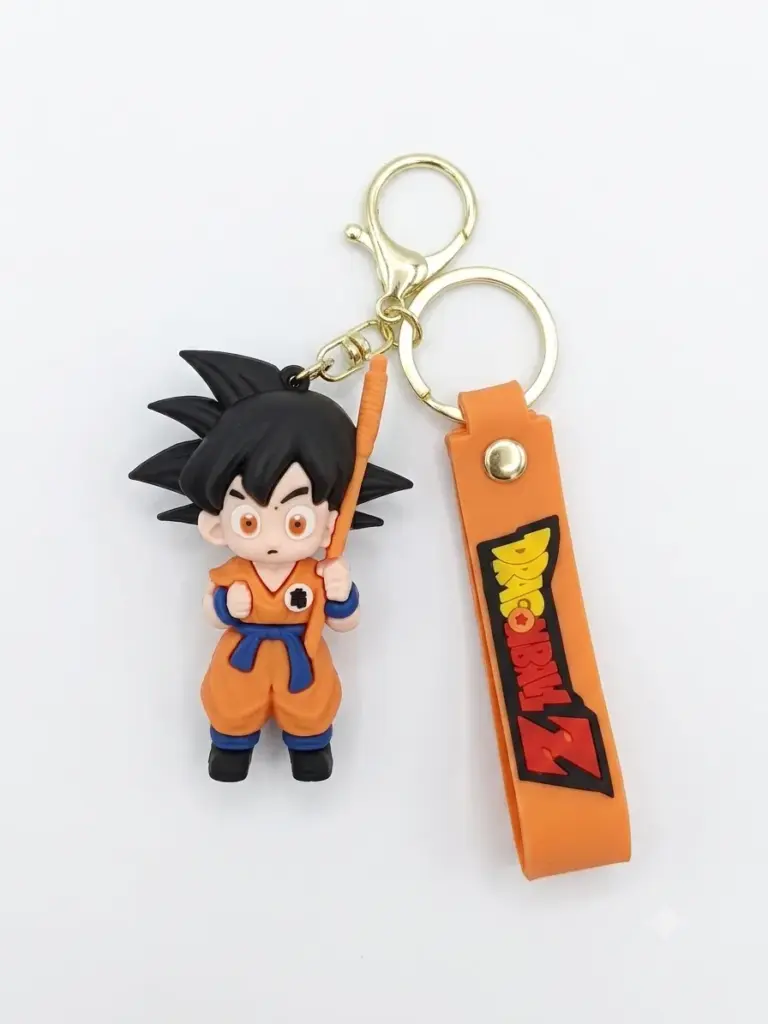 Portachiavi Dragon Ball Z con figura Son Goku in gomma arancione, moschettone dorato e linguetta con logo