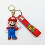 Portachiavi Super Mario Modello 2 con figura 3D in PVC rosso e blu, cinturino silicone rosso con scritta SUPER MARIO multicolore e moschettone dorato