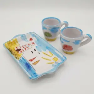 Set ceramica due tazzine da caffè e vassoio rettangolare bianco con decori azzurri, faro, sole e scritta Calabria