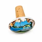 Tappo di sughero con base ovale stampata con immagine del Villaggio Bahja, piscina e conchiglie